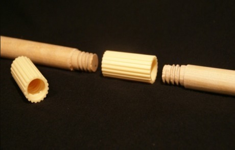 Two wooden threaded dowels joined with a plastic connector for extended-length applications.