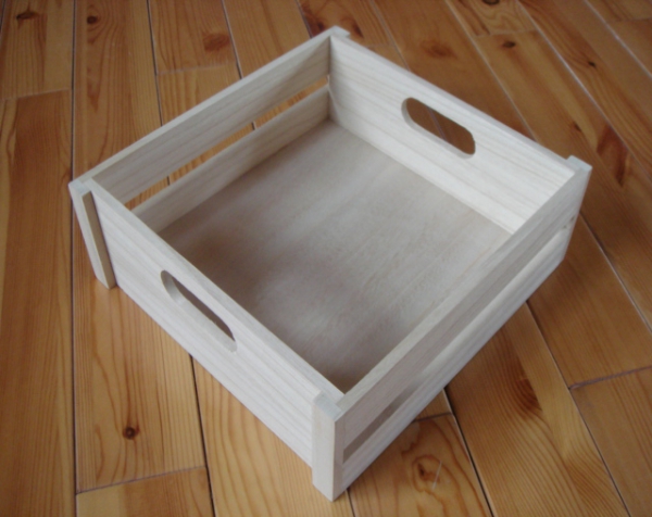Custom wooden crate with hand cut outs on both ends.