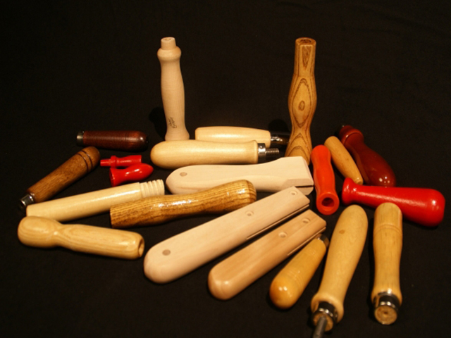 Collection of custom made small-sized wooden handles. Some have ends shown with various secondary operations and they all are finished in different colors, stain or clear finishes.