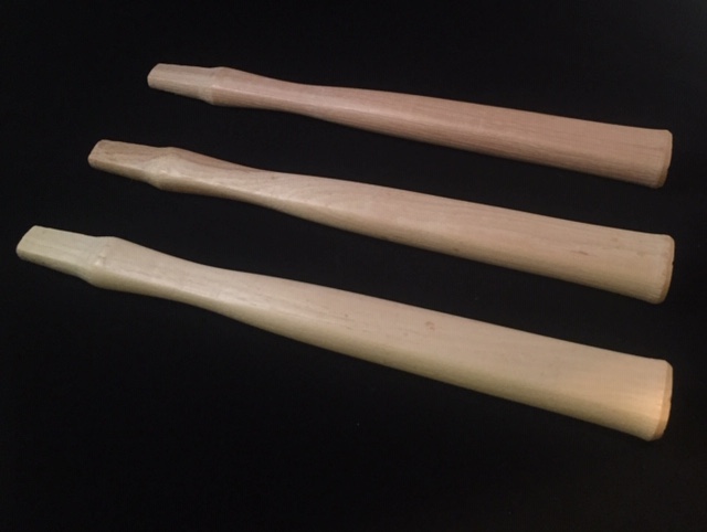 Three wood hammer handles with a tumbled wax finish.