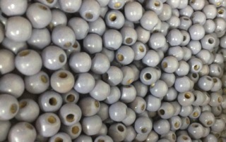 Custom wood beads painted in gray with a smooth finish.