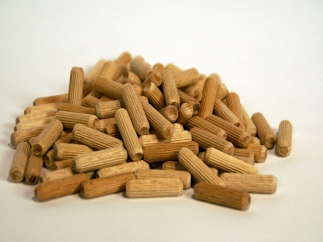 A collection of custom wood dowel pins with fluted and spiral grooves, designed for bulk joinery and cabinetmaking use.