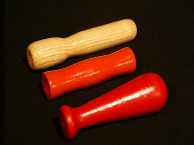Three custom wood jump rope handles. Two are red and one is shown in a natural finish.