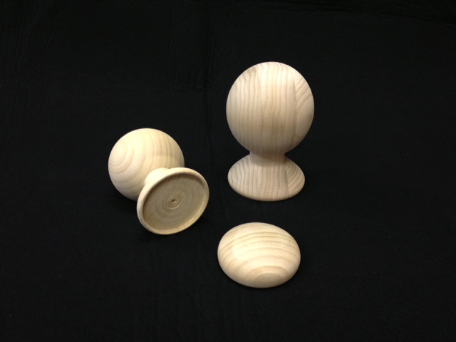 Two small poplar ball wood finials and one small poplar wood cap finial.