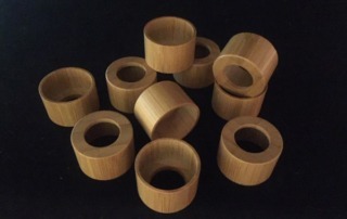 Bamboo wood caps, precision-turned for manufacturers and high-volume production runs.