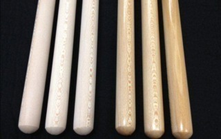 A bundle of strong, precisely milled oak wood dowels, prepared for woodworking and industrial applications.