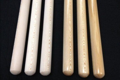 A bundle of strong, precisely milled oak wood dowels, prepared for woodworking and industrial applications. 