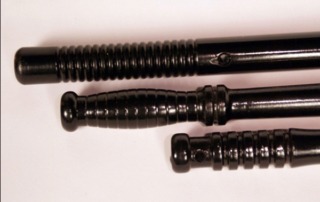 Bulk painted wood batons for manufacturers and high-volume production. Custom wood turnings in a black finish.