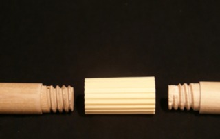 Custom threaded wooden dowels featuring a plastic connector, designed for bulk manufacturing and assembly applications.