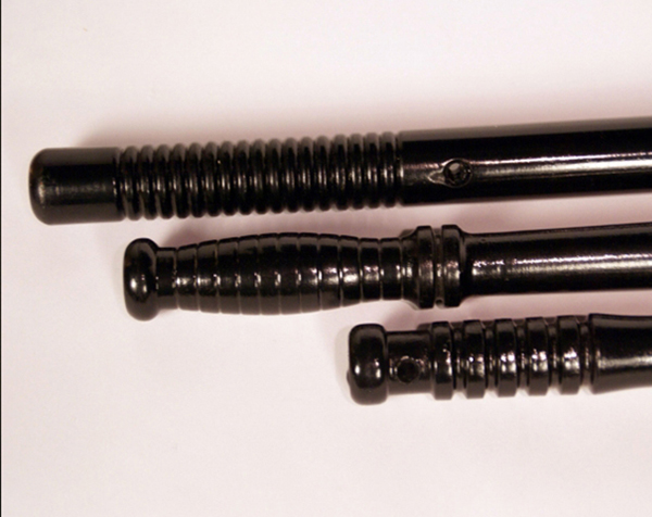 Custom wood turnings made into three black painted wooden batons.