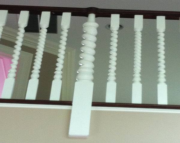 Up close view of installed spiral wood balusters