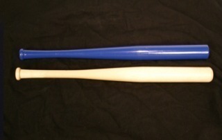Two custom wooden bats in different sizes, showcasing finishing options. Available in bulk for large-scale manufacturing.