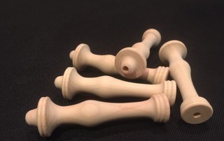 Unfinished white hard maple rug hook handles, available in bulk for manufacturers and large-scale production.