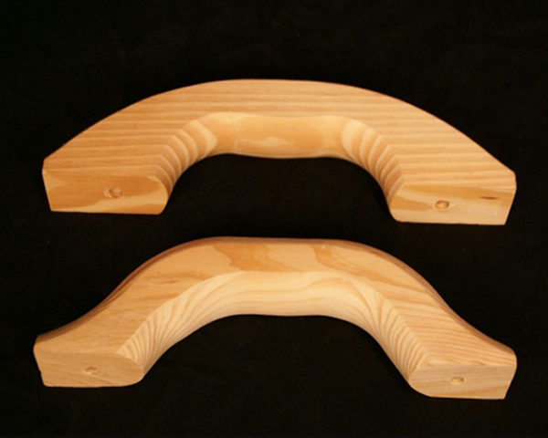 Two wooden float handles in a natural finish