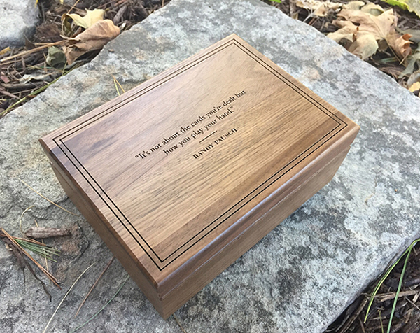 Hinged top walnut custom wood box with laser engraving on lid and a clear satin finish