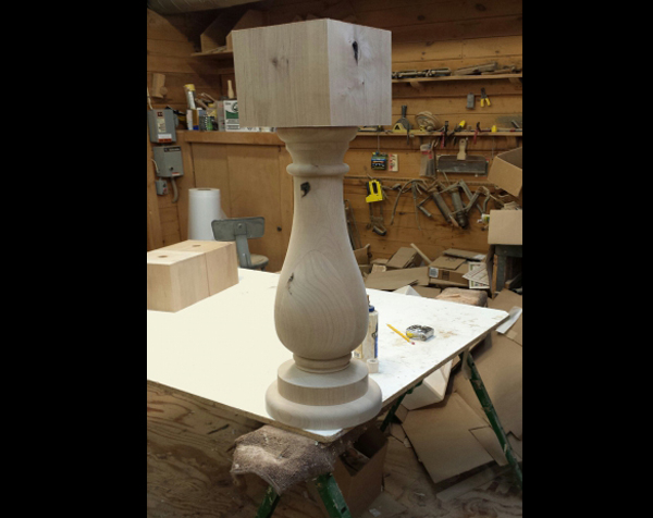 Knotty alder column with round base and large square top