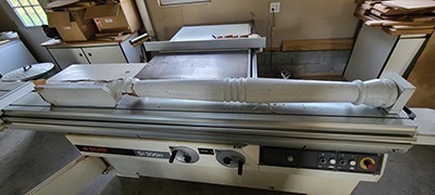 An old wood column provided by the customer as a sample for custom replication.