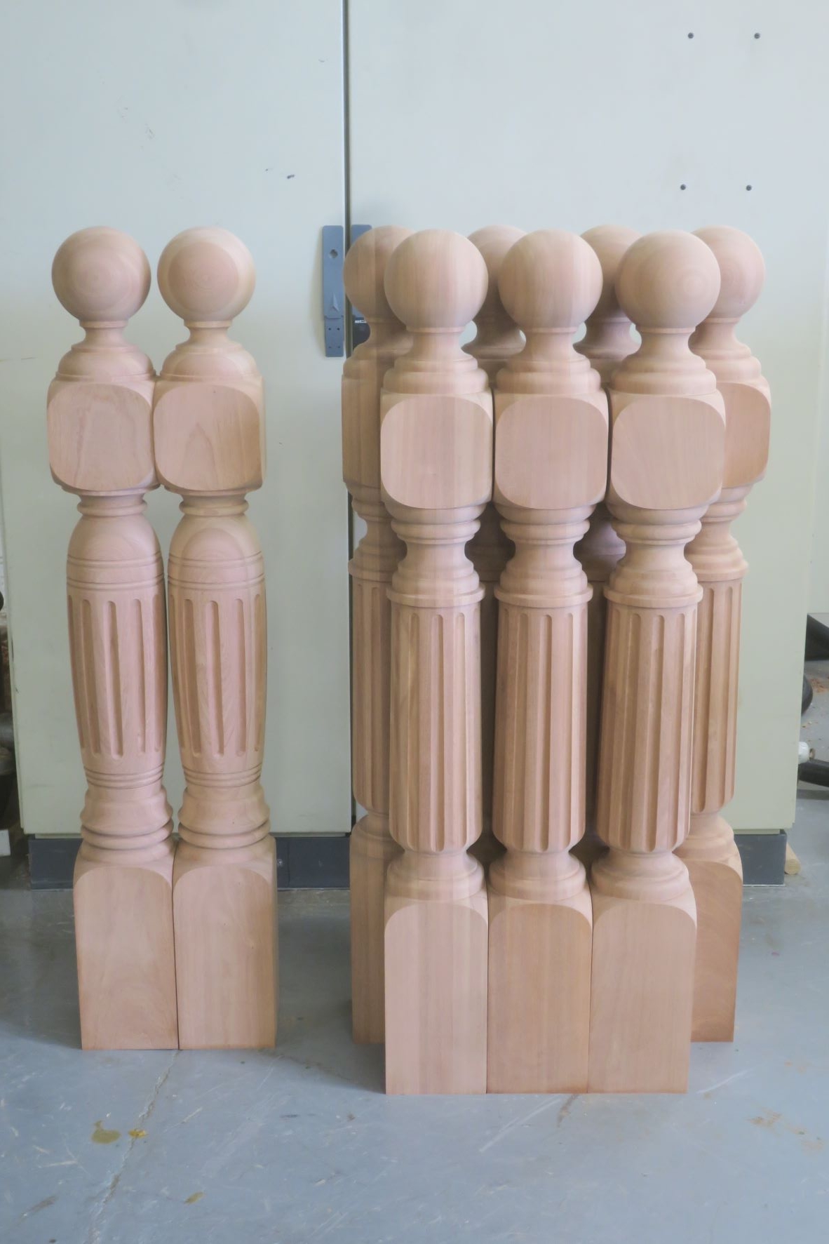 Fluted Sapele Newel Posts with a ball cap.