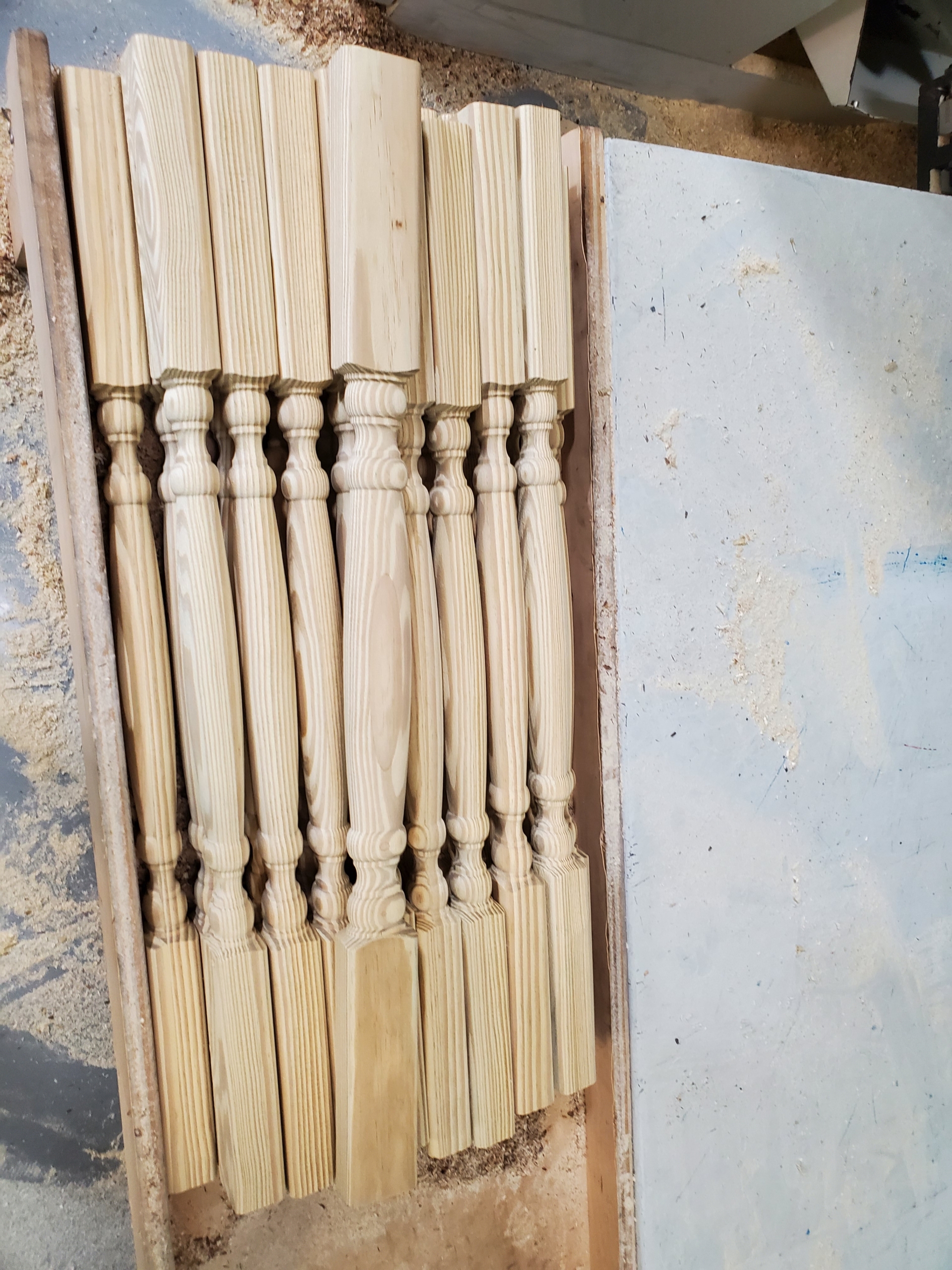 Dry pressure-treated yellow pine oval balusters.