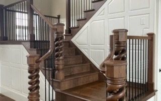 White Oak newel posts installed in a staircase with a custom finish, designed for staircases and architectural millwork.