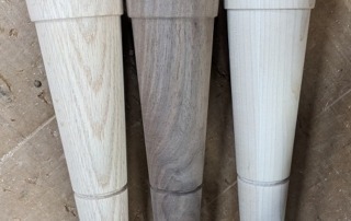 Custom vanity legs crafted in Red Oak, Walnut, and Hard Maple, designed for furniture and architectural millwork.