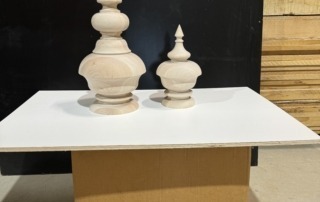 Custom poplar finials, expertly replicated for architectural restoration, staircases, and decorative woodworking.