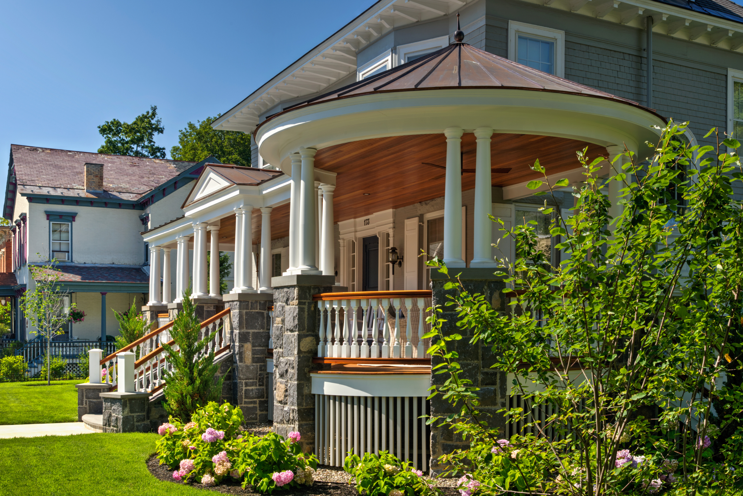 Teakwood Balusters Installed on an Exterior Home Railing Teakwood balusters installed on an outdoor home railing, showcasing natural durability and craftsmanship.