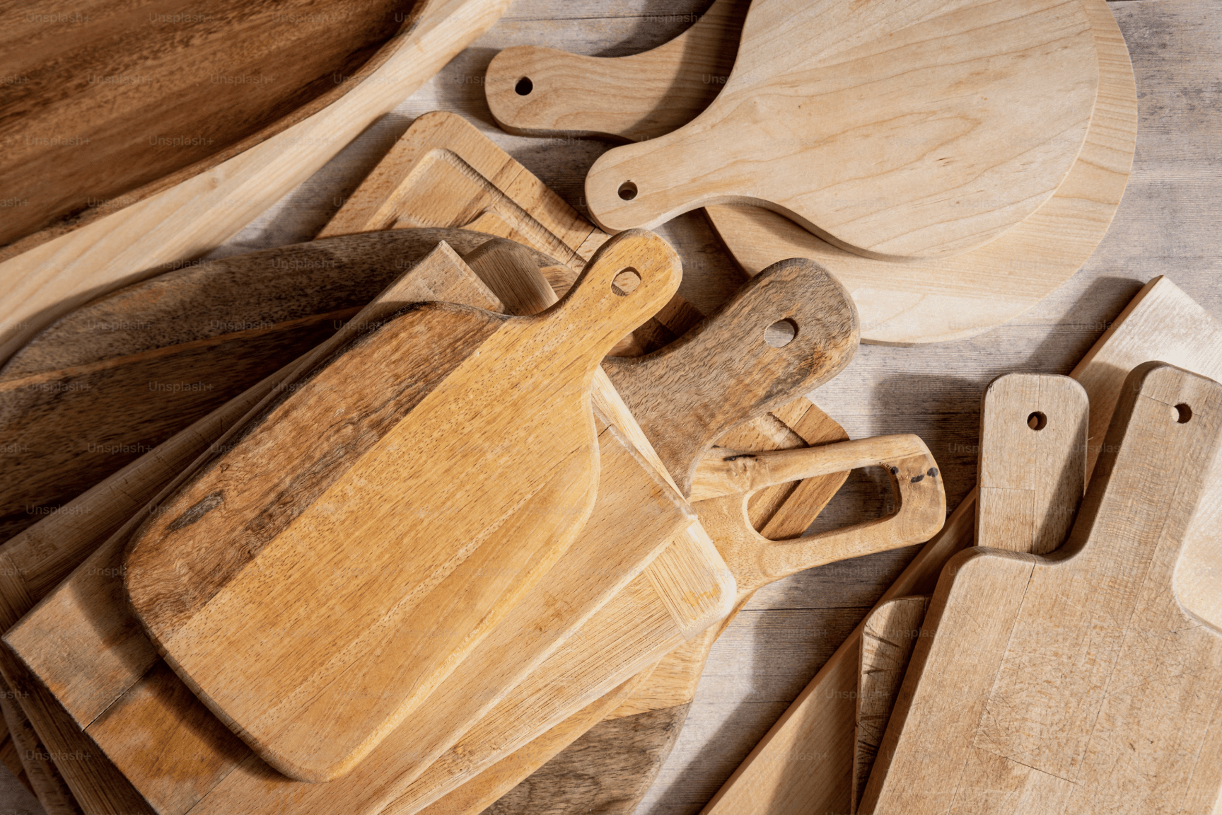 Variety of Wood Cutting Boards by Grain and Species Assorted wood cutting boards showing variations in grain, species, and construction.