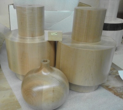 Large decorative lamp bases turned from soft maple with a clear finish, produced as samples for a commercial lighting manufacturer.