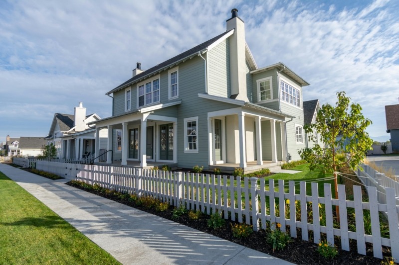 Front porch with painted wood columns exposed to sunlight and airflow, showing best practices for preventing mold on exterior wood surfaces.