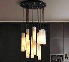 Ceiling-mounted alabaster chandelier with multiple hanging pendant lights in staggered lengths.