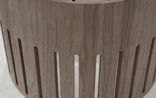 CNC-routed walnut ceiling mounted lighting shade for custom and bulk lighting production.