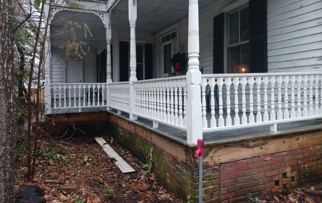 Paint-Grade Exterior Porch Balusters Installed on Traditional Porch Paint-grade exterior porch balusters installed along a traditional wraparound porch railing.
